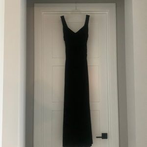 Floor length dress.  Flattering neck line. Zipper back. Ruched mid section.